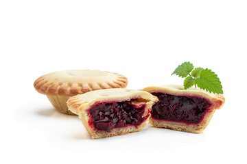Mini berry confiture pies isolated on white
