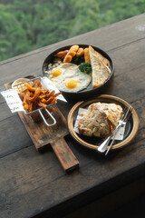 Delicious breakfast spread with scenic green view