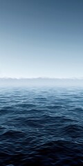 Obraz premium Tranquil view of the open ocean with a clear horizon under a calm blue sky, perfect for peaceful and serene themed projects.