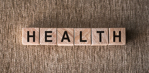 Wooden Cubes on a Textured Surface Spelling Out the Word Health