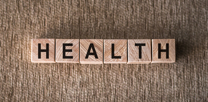 Wooden Cubes on a Textured Surface Spelling Out the Word Health