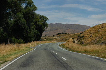 Road leading to a lake and hills New Zealand No People