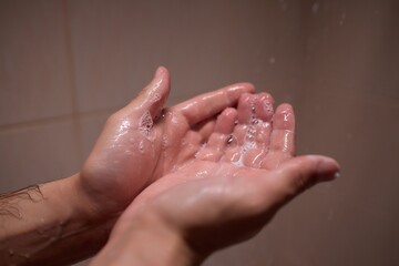 Fototapeta premium To maintain good hygiene and health, individuals cleanse their hands using water