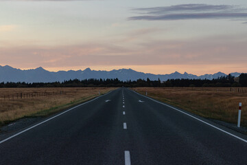 Open road with mountains at sunrise New Zealand sunset no people outside