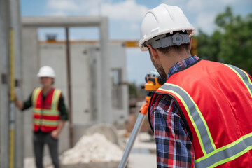 Civil or construction engineer using a survey camera, or an engineer with an auto level camera.