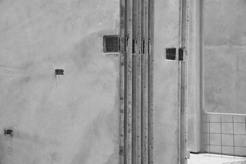 Geometrically shaped concrete walls and pillars, emphasizing modern architectural design..