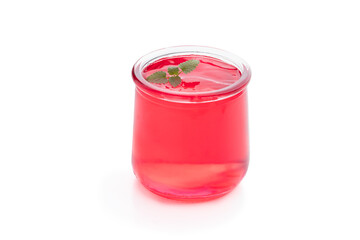 Red strawberry jelly in a glass jar isolated on white