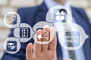 Business man using virtual screen sees text: REFER A FRIEND. Referral marketing or affiliate marketing concept. Invite friends to refer a friend loyalty program to win online reward. Refer and earn.