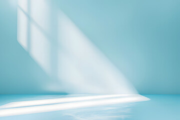 Minimal abstract light blue background for product presentation. Incident light from window on wall and floor.
