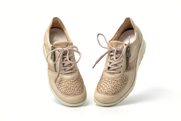 Beige female fashion sneakers walking isolated on white background
