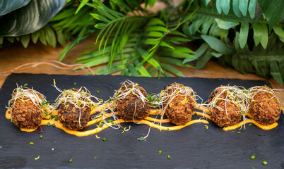 Portion of gourmet chicken, seafood and ham croquettes
