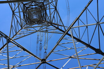 Fototapeta premium Power line details in extreme close-ups against a clear blue sky. Perfect illustrations for most things in the energy field.