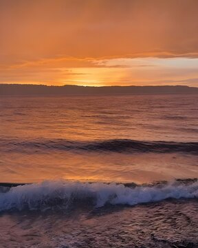 Closeup sea sand beach. Panoramic beach landscape. Inspire tropical beach seascape horizon. Orange and golden sunset sky calmness tranquil relaxing sunlight summer mood. Vacation travel holiday banner