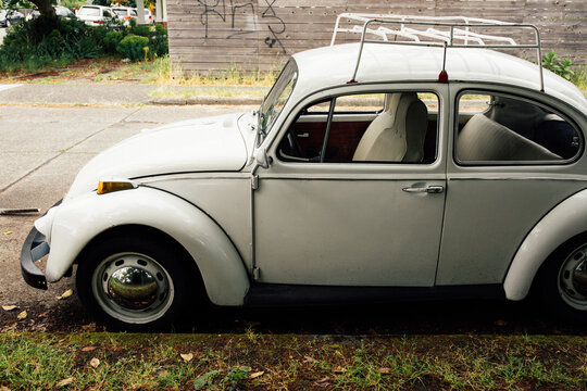 old white VW beetle from the 1970s with luggage rack on top