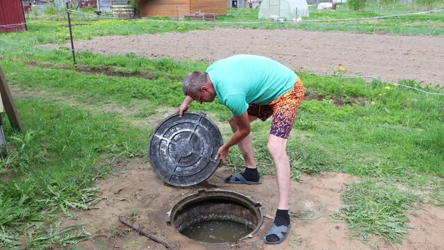 Septic Tank Composite Manhole Cover, homeowner opens sump for service.