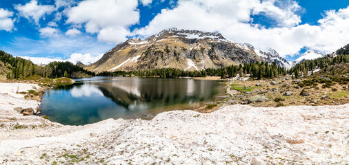 A view of the Cavlocc lake, in Engadine, Switzerland, and the mountains that surround it.
