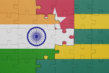 puzzle with the colourful national flag of togo and flag of india.