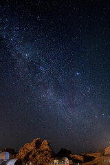 Fototapeta premium Night sky full of stars and milky way above Wadi Rum desert
