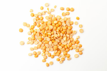 Split yellow peas pile on white background. Dry peas grains. Top view