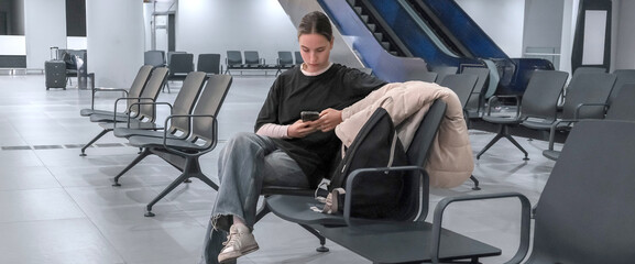 Travel, airport, woman waiting for a flight looking out the window, solo travel, airport transit...