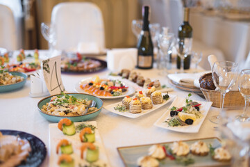 a lot of different food and snacks on the festive table