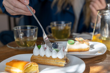 A fork is sticking out of a delicious pastry on a plate, ready to be enjoyed for breakfast.