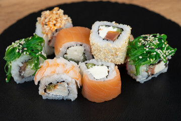 delicious traditional Japanese sushi and rolls on a plate