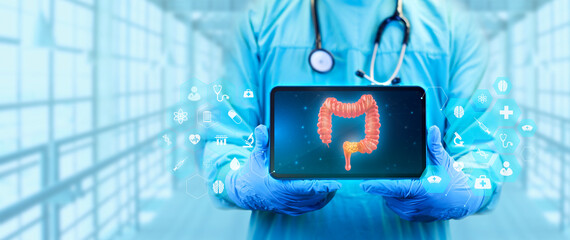 The doctor analyzes the image of the large intestine with colon cancer. Gastroenterologist isolated on light blue background with tablet. - Powered by Adobe