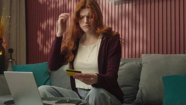 Caucasian confused puzzled woman try pay credit bank card online shopping home internet store laptop computer payment problem money trouble female girl client enter wrong password failure error fraud