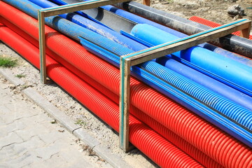 Bundle of plastic pipe for underground utilities on a construction site 