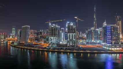 Dubai skyline at night with illuminated skyscrapers