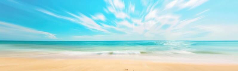 Abstract blur defocused background. Tropical summer beach with golden sand, turquoise ocean and blue sky with white clouds on bright sunny day