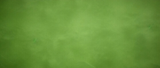 濃い緑色の背景またはスプレー ペイントのテクスチャ。緑のグランジ背景と抽象的な濃い緑色のマテリアル テクスチャ背景。