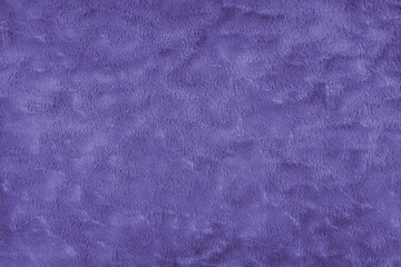 Texture of fluffy purple upholstery fabric or cloth. Fabric texture of artificial fur textile...