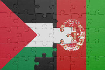 puzzle with the colourful national flag of afghanistan and flag of palestine.