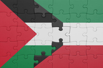 puzzle with the colourful national flag of kuwait and flag of palestine.