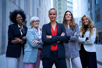 Group of multiracial and diverse ages smiling business only women in formal suit. Cheerful...