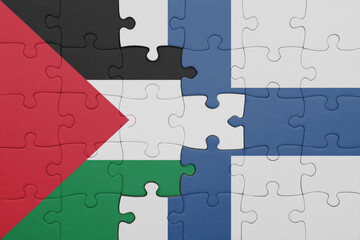 puzzle with the colourful national flag of finland and flag of palestine.