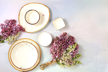 Elegant festive table setting, menu design in a cafe or restaurant, cutlery with lilac flowers on a...