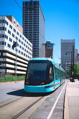 Kansas City Missouri Skyline and Skyscrapers on Main Street with street car on the road