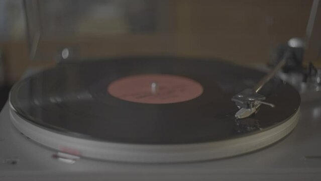 Classic vinyl record player. Shooting using a retro Helios 44-7 lens for authentic retro video . High quality 4k footage	