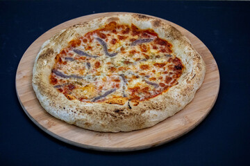 Traditional alicci or anchovy pizza, isolated in selective focus