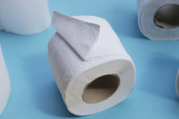 Toilet paper on blue background.