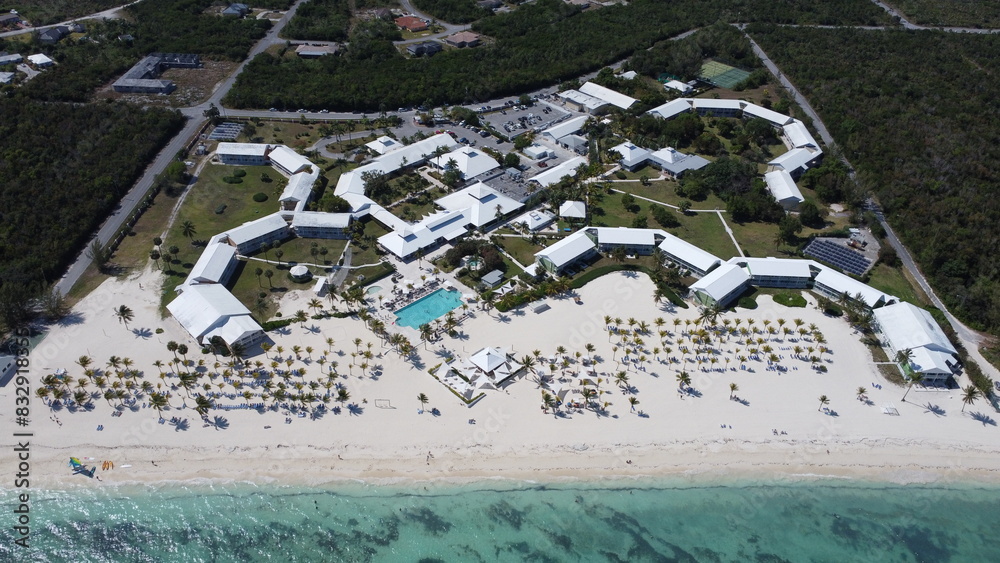 Sticker Aerial view of a beachfront resort by the ocean