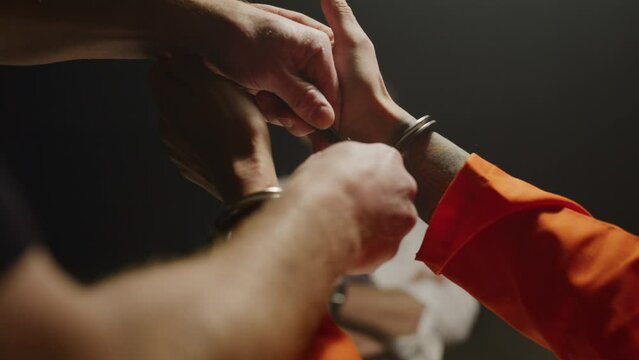 taking handcuffs off of an inmate being questioned by police
