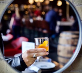person holding a glass