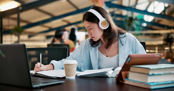 Girl, headphones and student writing at college, study and research for assignment or essay. Woman, learning and streaming podcast lecture at academy, planning and notes for knowledge at university