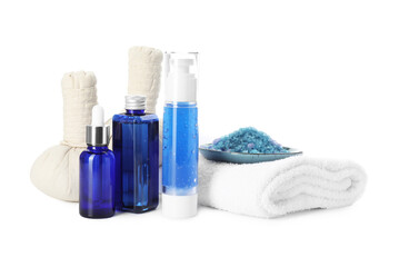 Spa composition. Bottles of cosmetic products, sea salt, towel and herbal bags isolated on white