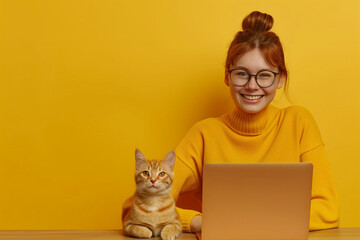 Fototapeta premium Happy White Woman Working on Laptop with Cat in Bright and Colorful Yellow Home Office