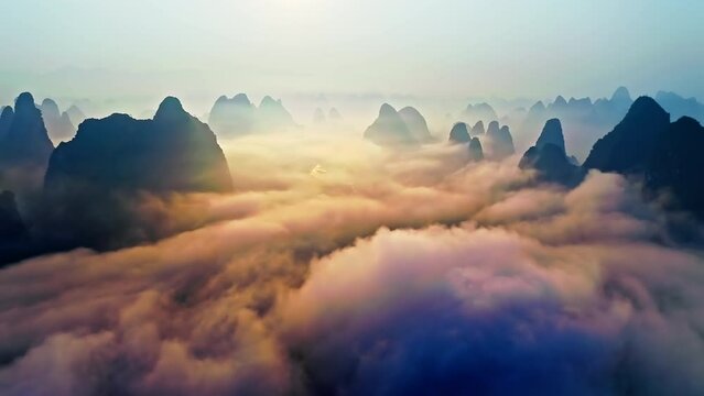 Aerial view of karst mountain and clouds natural landscape at sunrise in Guilin. Spectacular mountain range natural landscape in China.